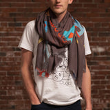 Djenné Wahala Mud Large Art Cashmere Blend Scarf loose wrap on male model in white t-shirt